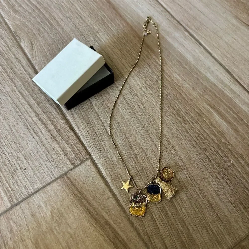 Gold-Tone Necklace with Star & Tassel Charms